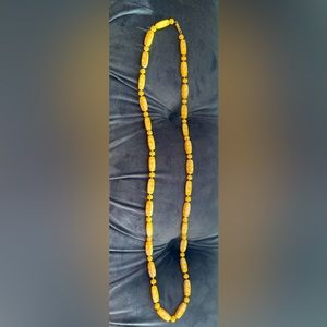 Vintage style yellow necklace with flower design